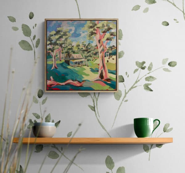 Escape to serenity with "The Cottage in the Hills" by Maggie Deall. This float-framed artwork captures a peaceful cottage scene with exquisite detail and warm colors, perfect for adding tranquility to any space.