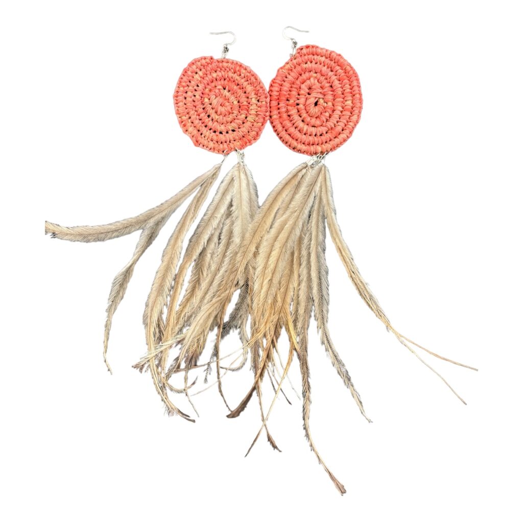 Discover the "Coral Dream" earrings from the NAIDOC Collection by Gomeroi artist Debbie Wood. Hand-woven with raffia and emu feathers, these earrings celebrate Indigenous culture and craftsmanship.