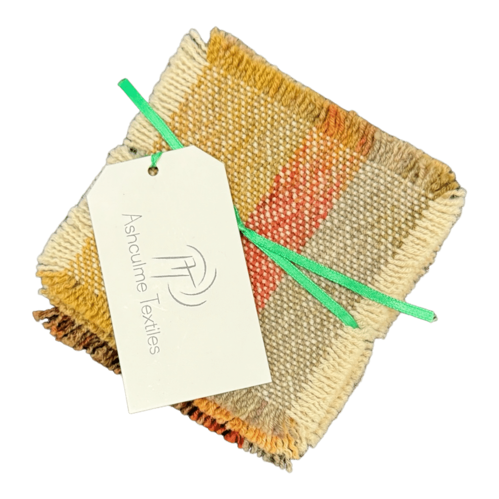 Discover the unique beauty of our Vibrant Sunset Coaster, handwoven from alpaca and silk wool, dyed with natural bush dyes. Perfect for adding a touch of color to any space.