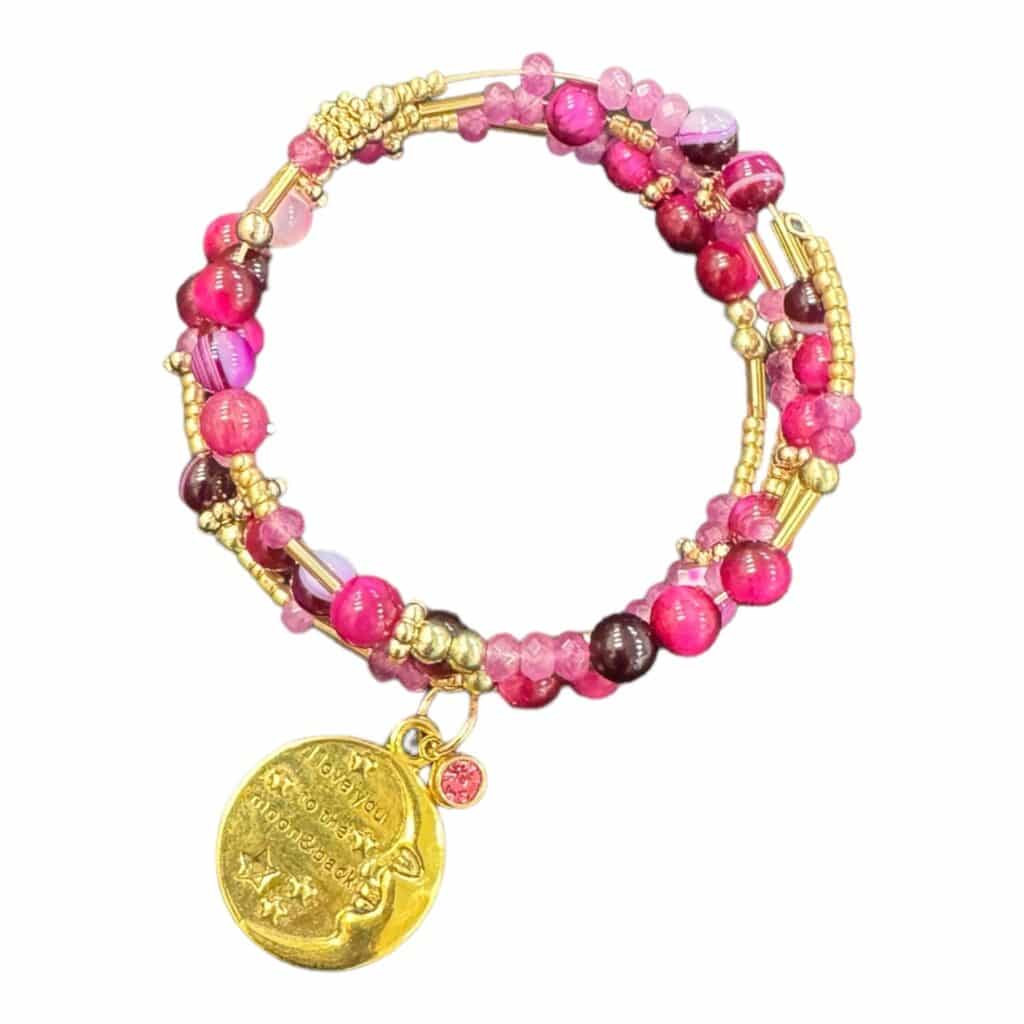 Express your love with the handmade "I Love You to the Moon and Back" memory wire bracelet, featuring rich pink gemstones, crystals, and a gold-plated charm. A heartfelt gift for someone special.