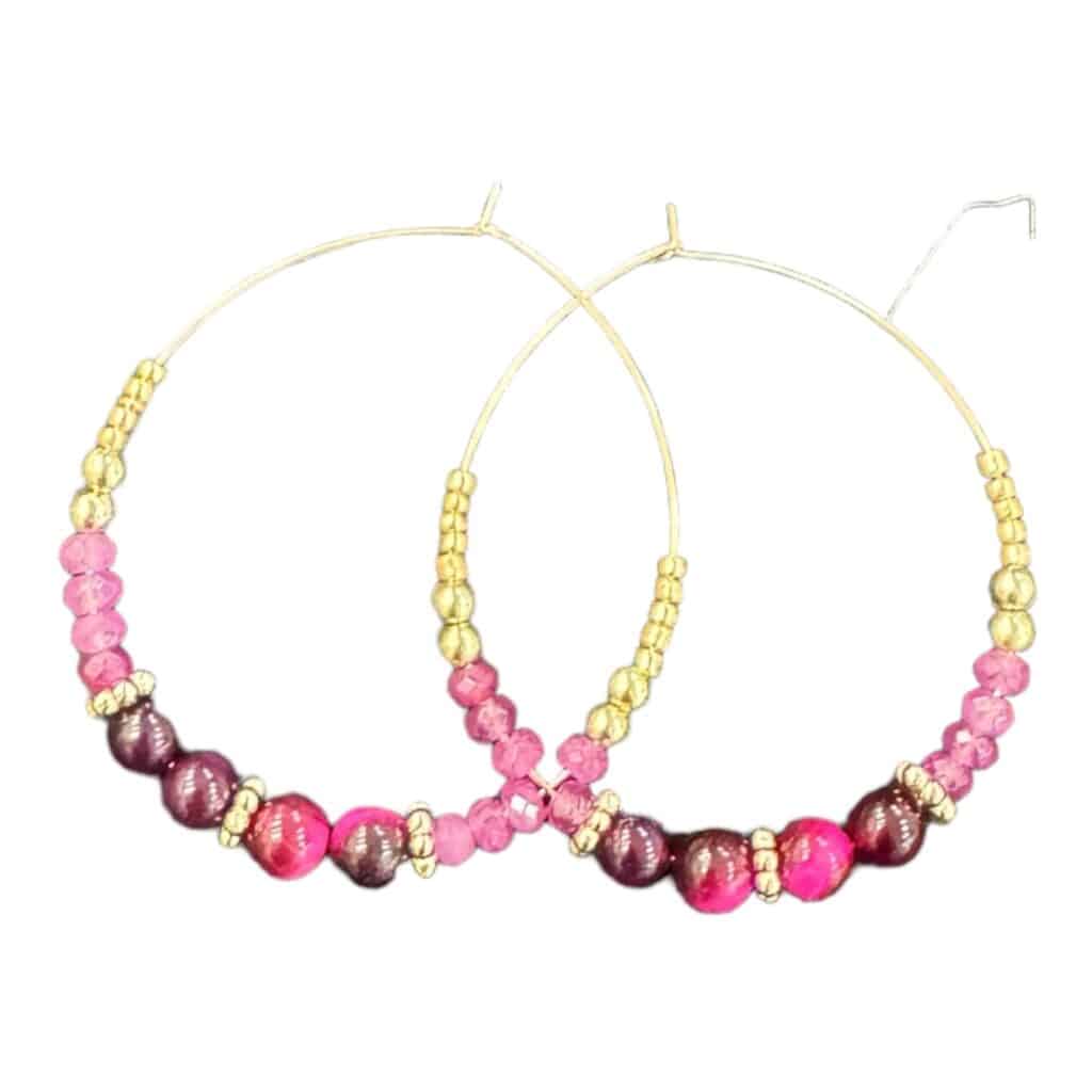 Make a statement with the Blush Berry earrings by Maggie Deall. Features deep berry and blush pink beads with golden accents, perfect for any occasion.