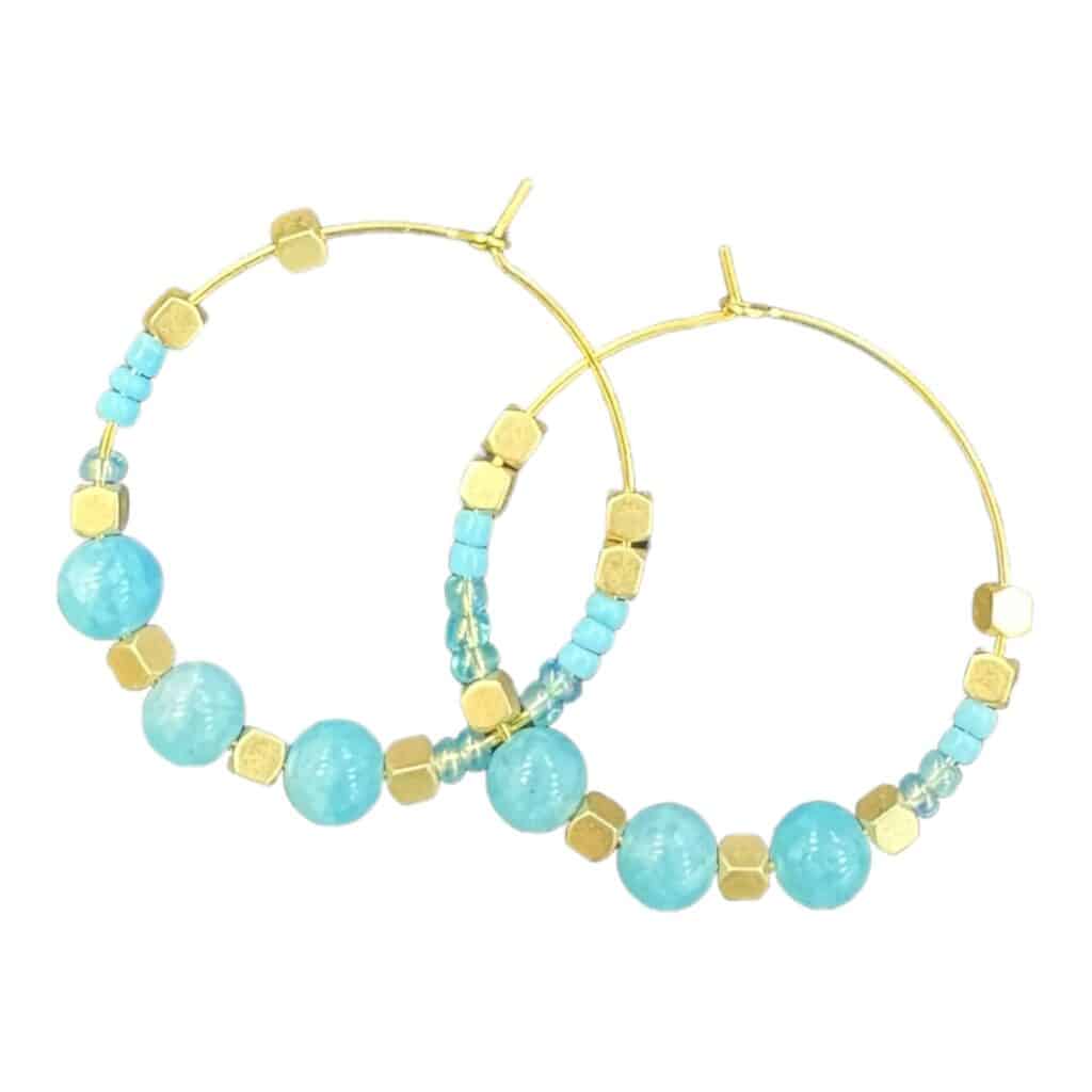 Add a pop of colour with Turquoise Waters earrings by Maggie Deall. Features vibrant turquoise beads with golden accents.