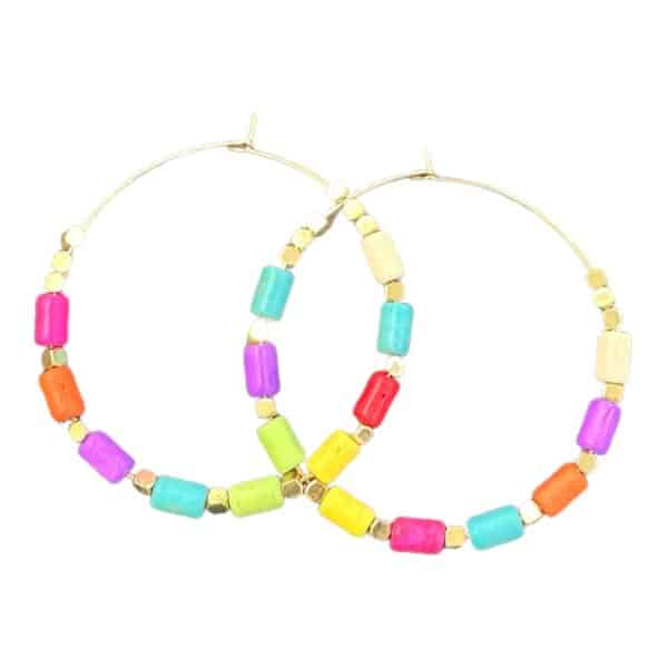 Stand out with Fiesta Fun earrings by Maggie Deall. Features a mix of vibrant beads with golden accents, perfect for any occasion.