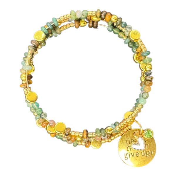 Stay motivated with the handmade "Never Give Up" memory wire bracelet, featuring earthy gemstones, crystals, and a gold-plated charm. A symbol of resilience and strength.