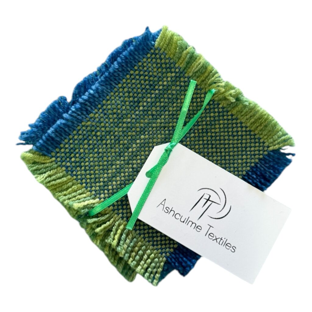 Enhance your home with the Ocean Breeze Coaster Set, handwoven with calming blue and green hues. Perfect for coastal or nature-inspired decor.