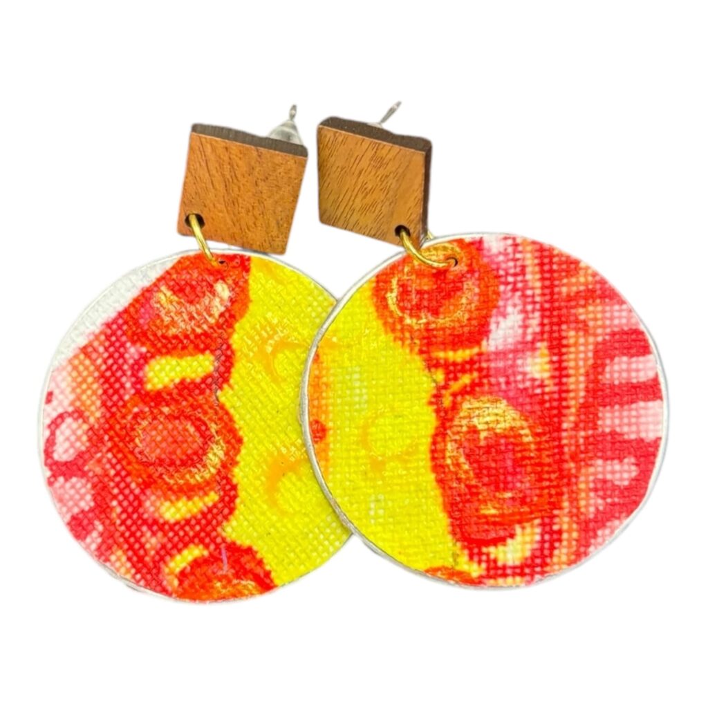 Brighten up your look with Sunburst Delight earrings by Lindy Farley – hand-painted, eco-friendly statement pieces made from upcycled coffee pods.