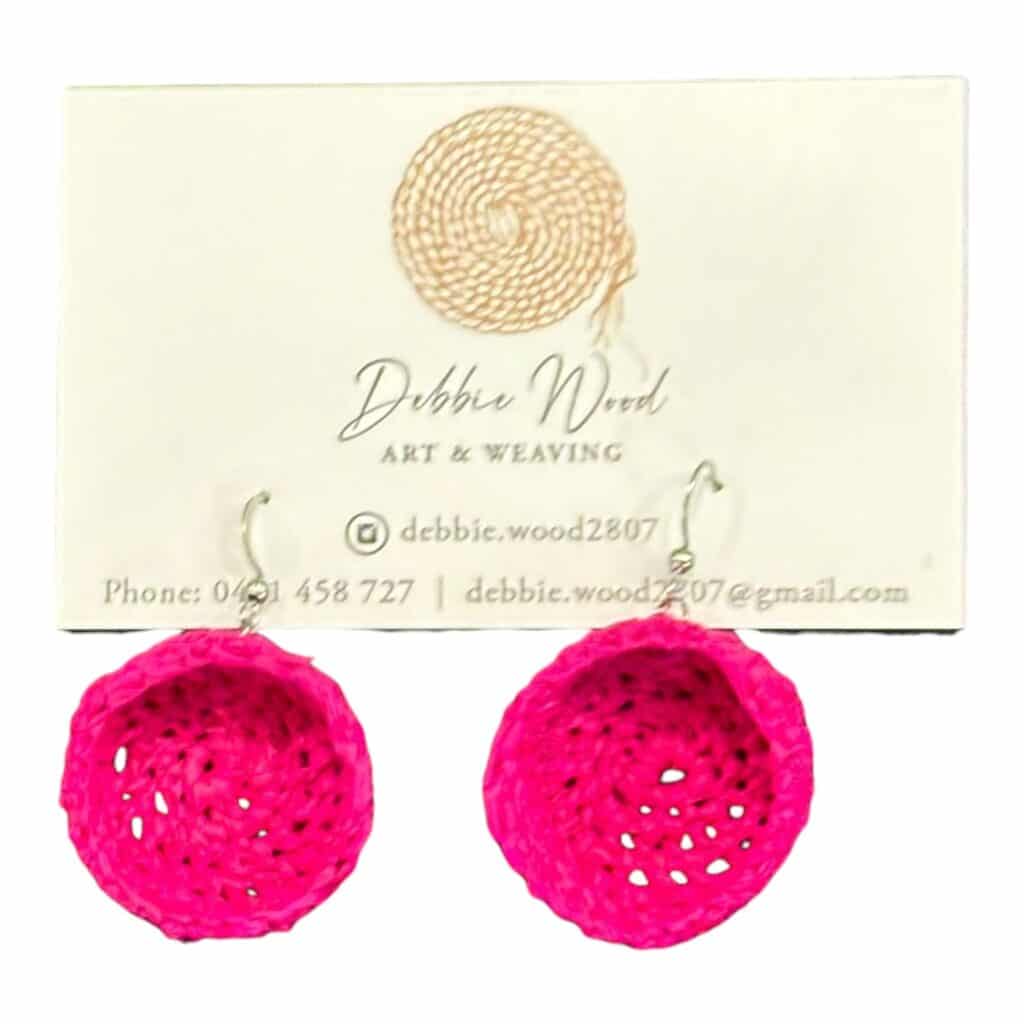 Bright Blossom handwoven earrings by Gomeroi artist Debbie Wood, crafted in raffia for a vibrant pink style that pops with playful energy.