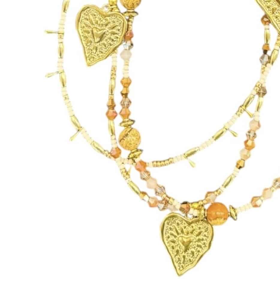 Heart of Gold necklace – a handcrafted, unique piece by Art in Stone Jewellery with golden heart charms and warm amber accents, perfect for a loving touch.