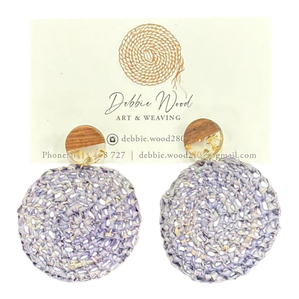 Lavender Fields handwoven earrings by Gomeroi artist Debbie Wood. Light purple raffia earrings inspired by the tranquility of lavender fields.