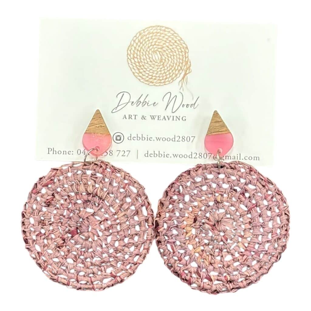 Blush Breeze handwoven earrings by Gomeroi artist Debbie Wood. Soft pink raffia earrings for a light and elegant touch.