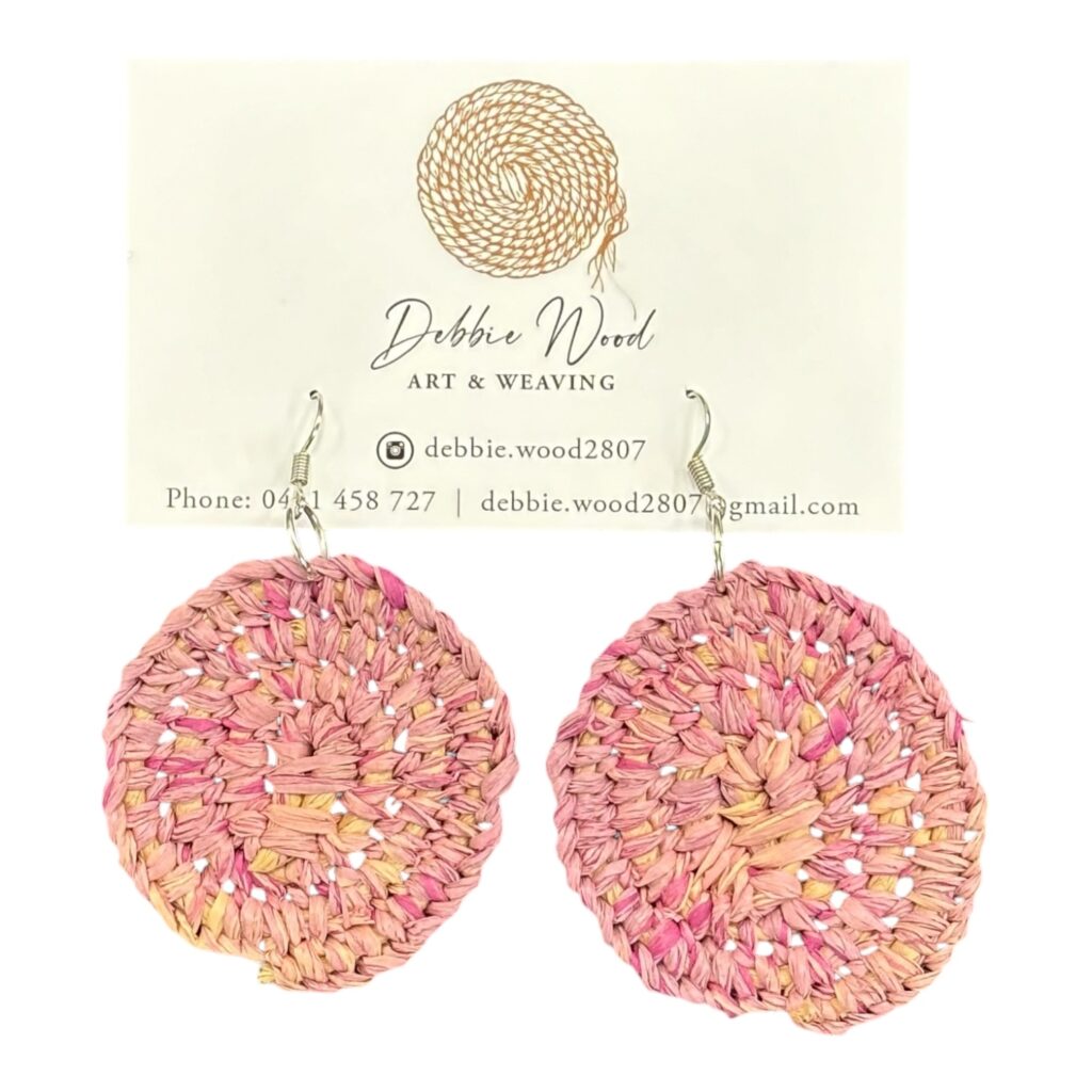 Blush Petal handwoven earrings by Gomeroi artist Debbie Wood. Pink raffia brings a delicate, floral-inspired elegance.